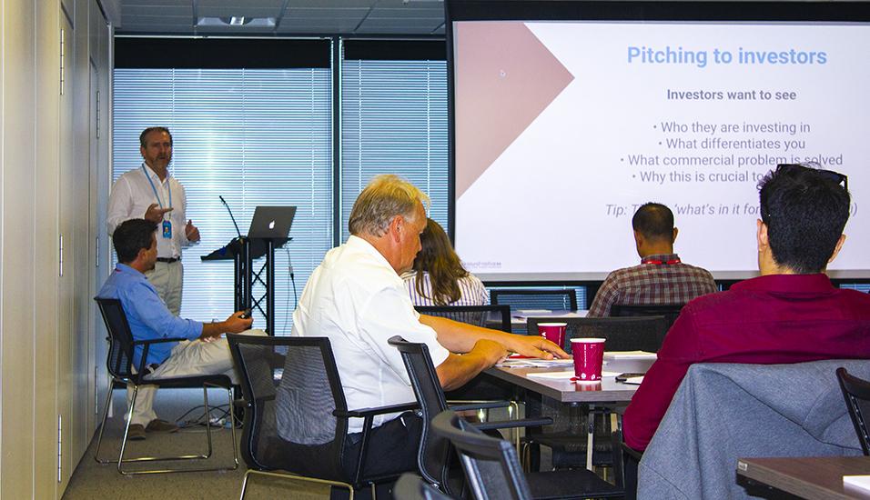 presenter talking in a room of people